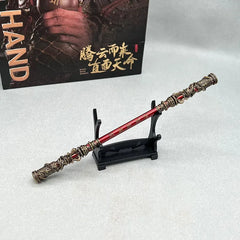 Anime-style zinc alloy staff replica with red accents on display stand, collectible by BlacksmithSONG.