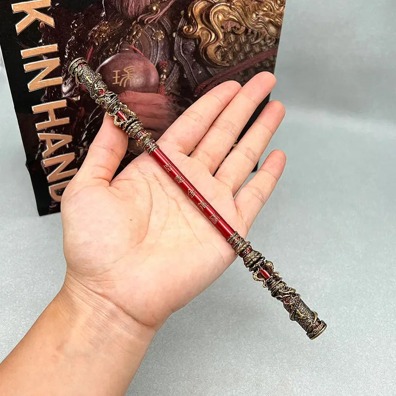 Hand holding 1:6 scale red anime-style zinc alloy staff replica, collectible display weapon