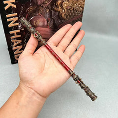 Hand holding 1:6 scale red anime-style zinc alloy staff replica, collectible display weapon