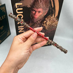 Hand holding a detailed 1:6 anime-style red zinc alloy weapon replica with ornate gold accents