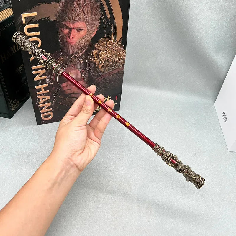 Hand holding 1:6 scale Sun Wukong staff replica, zinc alloy collectible, anime-style display