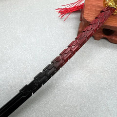 Anime-style zinc alloy sword replica with black and red blade, on display stand
