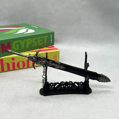 1:6 anime-style zinc alloy sword replica on display stand with books in background