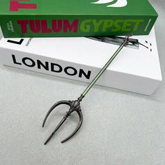 Anime-style zinc alloy trident replica collectible on books, BlacksmithSONG cosplay prop