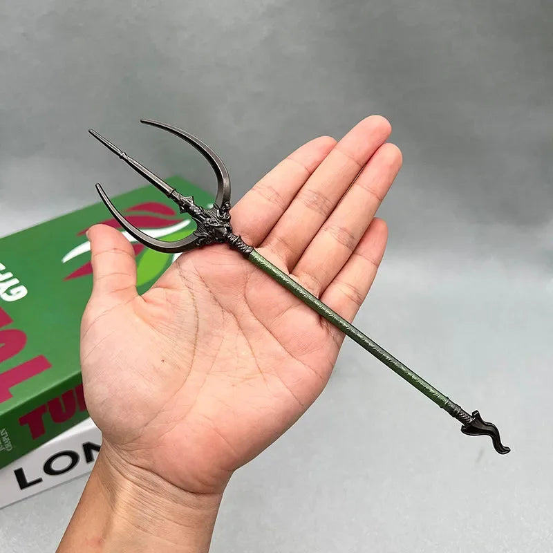 Hand holding a 1:6 scale anime-style zinc alloy trident replica for cosplay and display