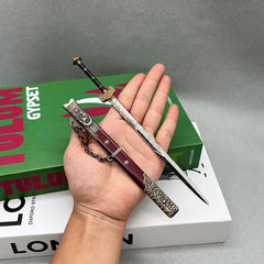 Hand holding 1:6 anime-style zinc alloy sword replica with ornate scabbard from BlacksmithSONG.