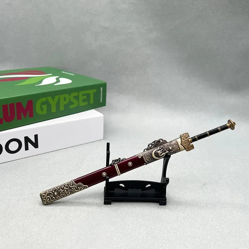 Anime-style 1:6 zinc alloy sword replica with ornate red and gold sheath on display stand
