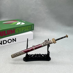 Anime-style zinc alloy sword replica with ornate red and gold details on display stand