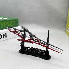 Anime-style red and black zinc alloy weapon replica on display stand, collectible decor