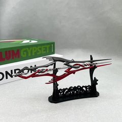 Anime-style zinc alloy spear replica with red and black design on display stand, BlacksmithSONG collectible.