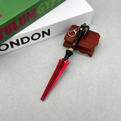 1:6 scale anime-style red and black zinc alloy weapon replica on display stand