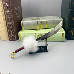 Anime-style zinc alloy sword replica with white fur pompom on display stand, collectible cosplay decor