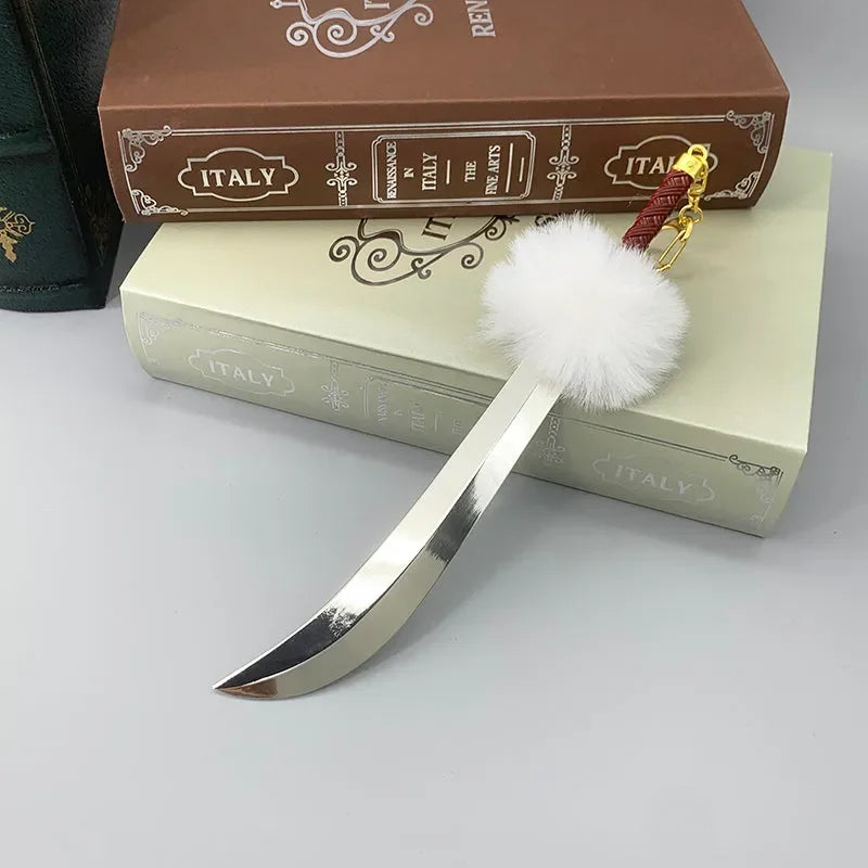 Anime-style 1:6 zinc alloy replica sword with white fluffy pom, displayed on books