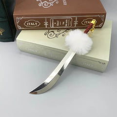 Anime-style 1:6 zinc alloy replica sword with white fluffy pom, displayed on books