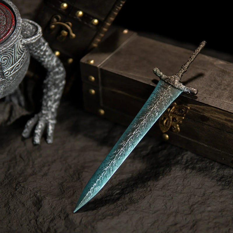 A gift from the Dark Moon.  This stunning Dark Moon Greatsword replica captures the magical frost essence of Ranni’s legendary weapon. Featuring intricate leaf patterns on the blade and a weathered antique finish. A perfect Elden Ring collectible for your desk setup or Ranni the Witch shrine.
