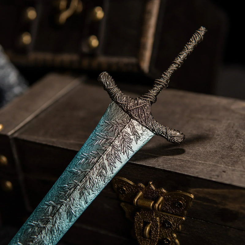 Zoom in on the frost details!  This Dark Moon Greatsword replica features incredible texture work on the blade and hilt. Made from high-quality zinc alloy, it's a solid piece of metal art that brings the Moonlight Greatsword to life. Perfect for Elden Ring collectors who appreciate fine craftsmanship.