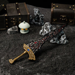 Full view of Maliketh's Black Blade replica, highlighting the gold hilt and dark jagged blade on a dark textured background.