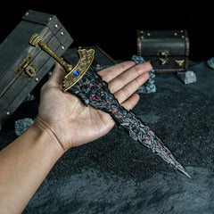 Hold the rune of Death! ?? This handheld shot shows the 30cm scale of our Maliketh's Black Blade replica. Even as a miniature, this metal sword captures the heavy, jagged look of the original Colossal Sword. A high-quality zinc alloy collectible for Elden Ring fans.