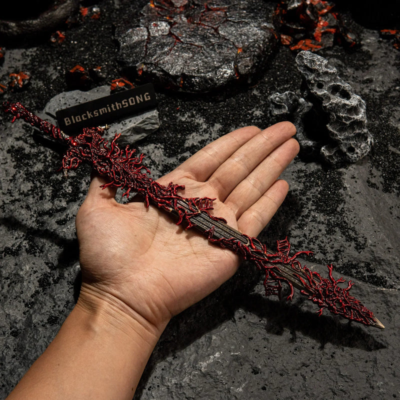 Wondering how big the Blasphemous Blade is in real life? ?? Here is the handheld scale of our 22cm metal replica. Cast from zinc alloy, it has a heavy, premium feel—not plastic. Ideal for Elden Ring collectors, desk display, or small-scale cosplay props. See the writhing details up close!