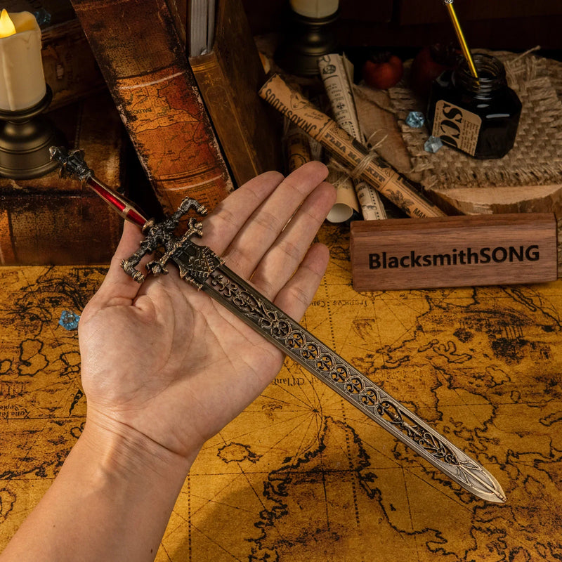 Hold the power of Night and Flame in your hand! ?? This handheld shot shows the true scale of our 22cm metal replica. Notice the intricate filigree details on the blade and the gemstone accents. A high-quality zinc alloy collectible for Elden Ring lovers and desk warriors.