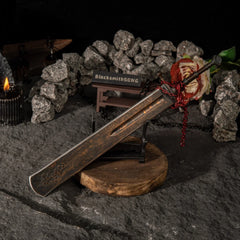 A tribute to the Shaded Castle. ?? This Marais Executioner's Sword metal replica sits menacingly on a custom stand, surrounded by iron chains and roses. The perfect gaming desk decoration for Elden Ring players who master the Arcane arts and the Eochaid's Dancing Blade. - Small display stand