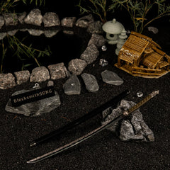 Unleash the Transient Moonlight.  This Moonveil Katana metal replica is a masterpiece of craftsmanship. Displayed in a serene Zen garden setting, it captures the magic and elegance of the best Intelligence weapon in Elden Ring. A standout desk decoration for any sorcerer or samurai.
