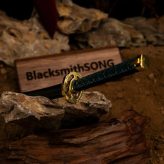 1:6 scale anime-style zinc alloy sword replica by BlacksmithSONG displayed on rocks