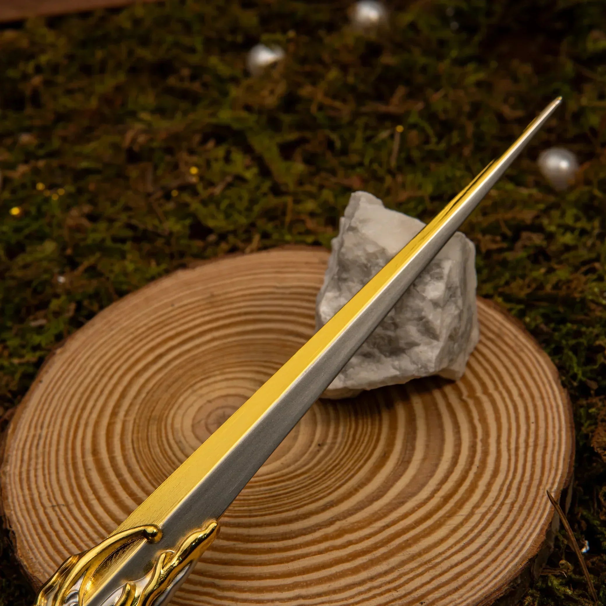 1:6 anime-style zinc alloy replica sword with gold and silver blade on wood slice display