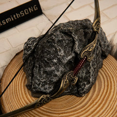 Aesir Bow replica — bow limb scrollwork and grip detail, close-up.
