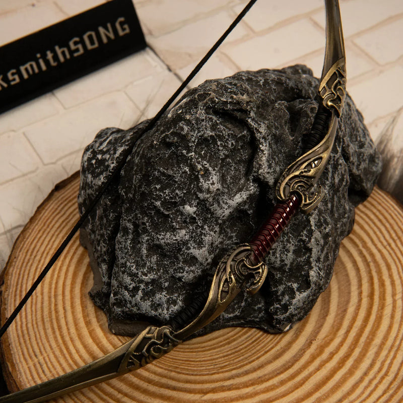Aesir Bow replica — bow limb scrollwork and grip detail, close-up.