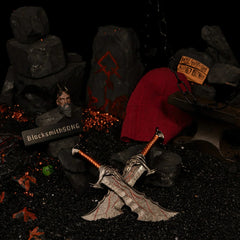 Blades of Chaos replica — the pair on black volcanic grit beside rune-carved stone and glowing embers.