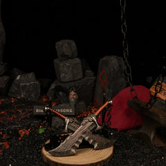 Blades of Chaos replica — displayed on the large stand inside the handcrafted lava set.