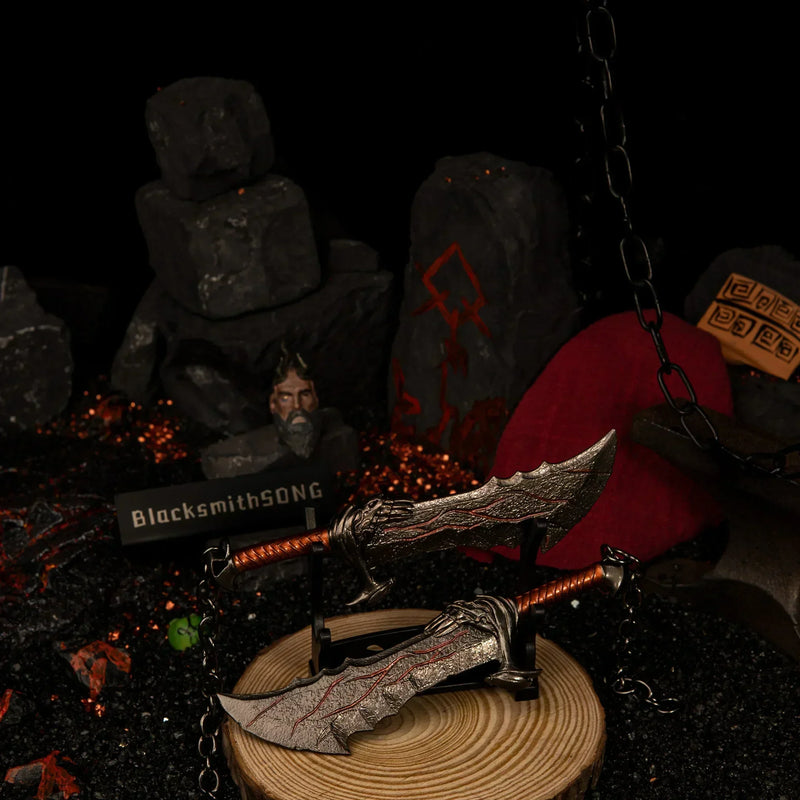 Blades of Chaos replica — displayed on the small stand beside glowing embers.