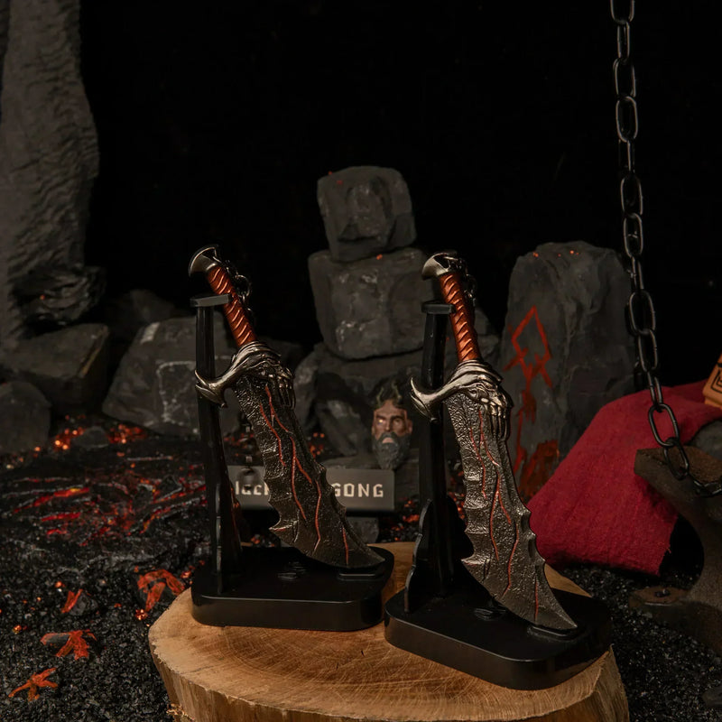 Blades of Chaos replica — standing upright on the vertical stand by the rune-carved stone.