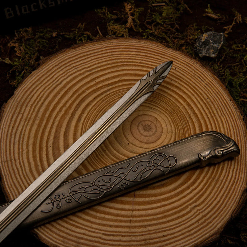 Thrungva replica — scabbard knotwork and bird-head finial close-up.