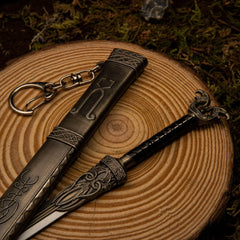 Thrungva replica — pommel, guard, and scabbard laid on a wood display base.