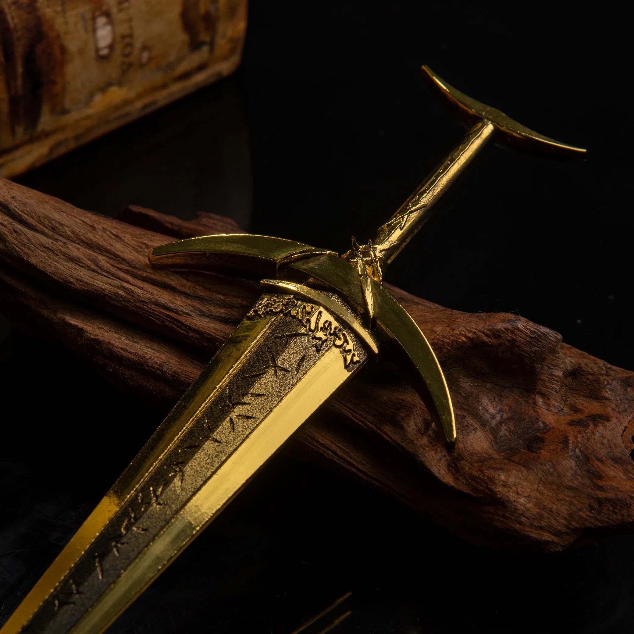 Close-up detail of the Golden Order Greatsword hilt and crossguard, showing intricate gold engravings.