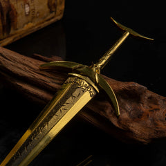 Close-up detail of the Golden Order Greatsword hilt and crossguard, showing intricate gold engravings.