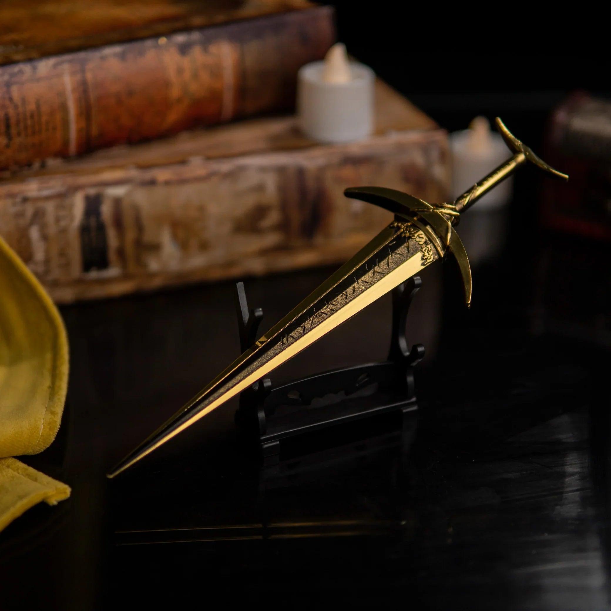 Golden Order Greatsword replica displayed horizontally on a small black stand.