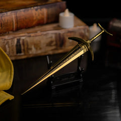 Golden Order Greatsword replica displayed horizontally on a small black stand.