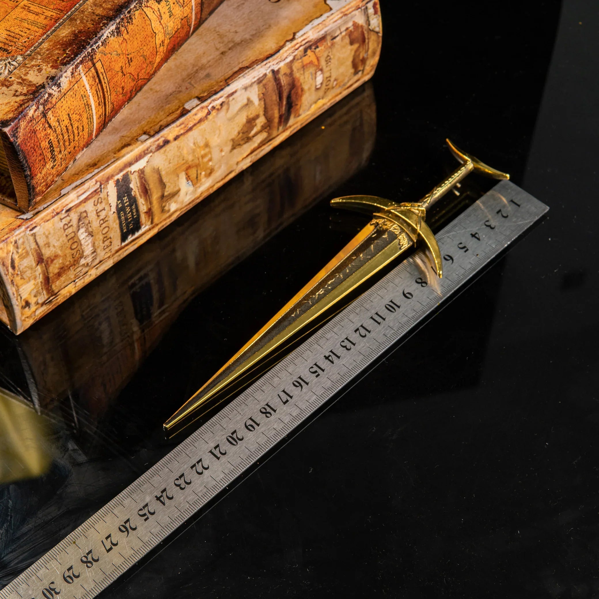 Golden Order Greatsword replica placed next to a ruler showing a length of approximately 22cm.