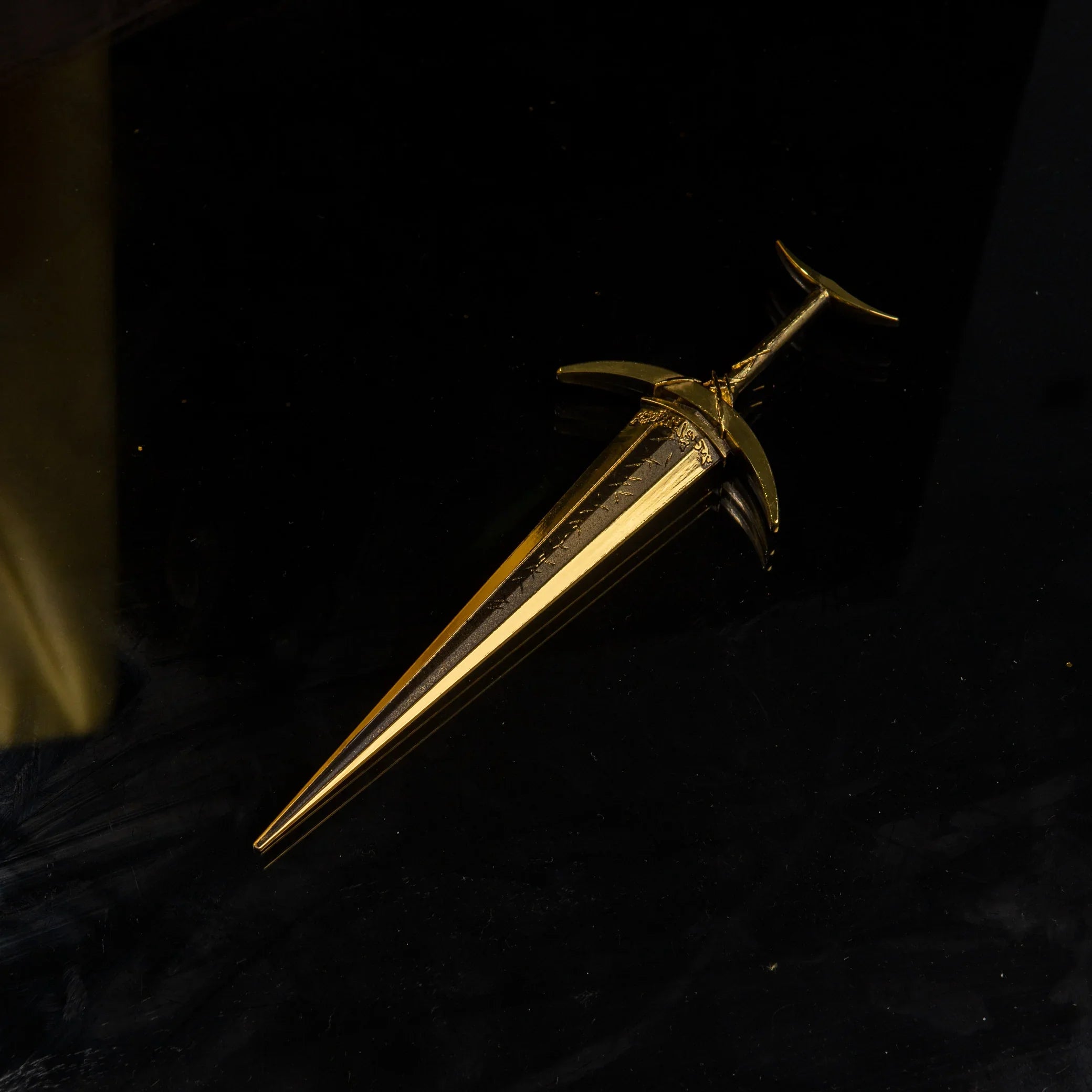 The Golden Order Greatsword isolated on a black background, showing the full weapon shape.