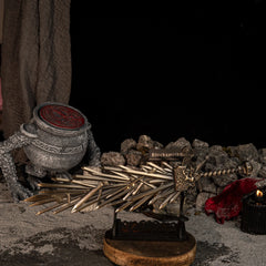 Grafted Blade Greatsword displayed horizontally on a large wooden stand with pot props in the background.