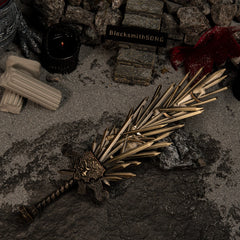 Full view of the Grafted Blade Greatsword replica on a grey textured surface with red cloth details.