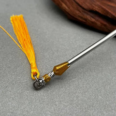 1:6 scale anime-style zinc alloy weapon replica with gold tip and yellow tassel on gray