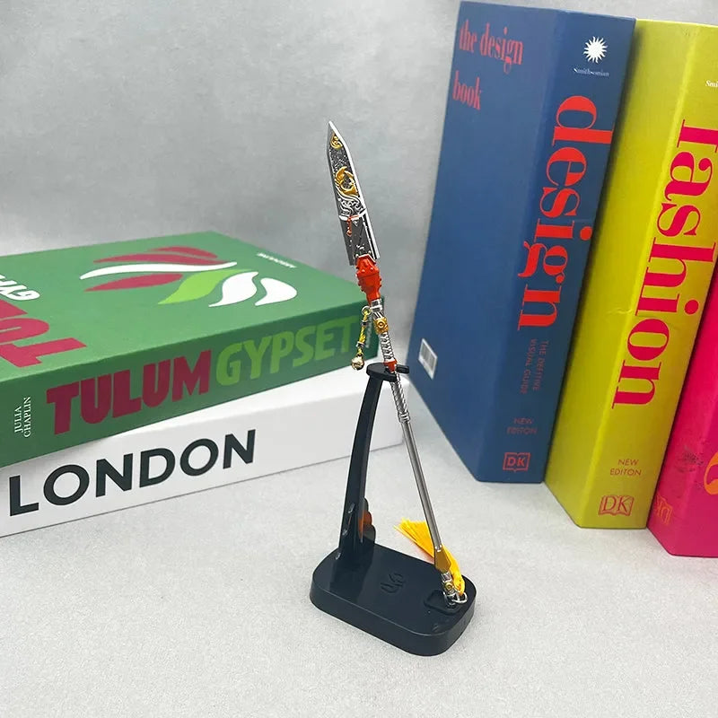 1:6 anime-style zinc alloy weapon replica on stand, displayed with colorful books