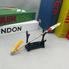 1:6 anime-style zinc alloy spear replica with yellow tassel on display stand, books background