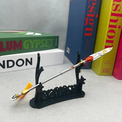 1:6 anime-style zinc alloy spear replica on display stand, with books in the background.