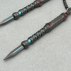 Anime-style zinc alloy weapon replica pendant with blue and red accents on grey background
