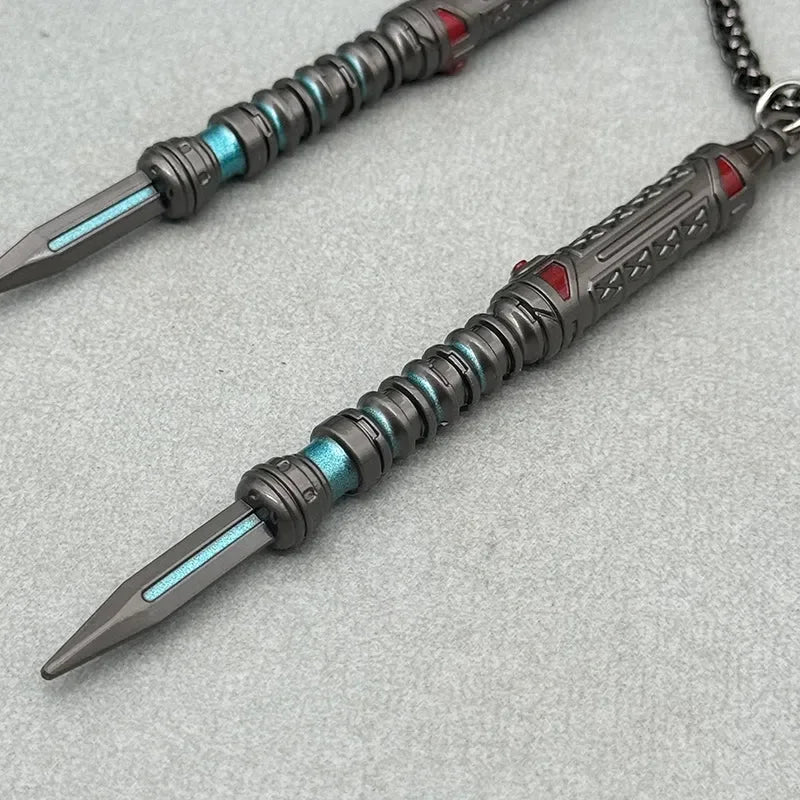 Anime-style zinc alloy weapon replica pendant with blue and red accents on grey background